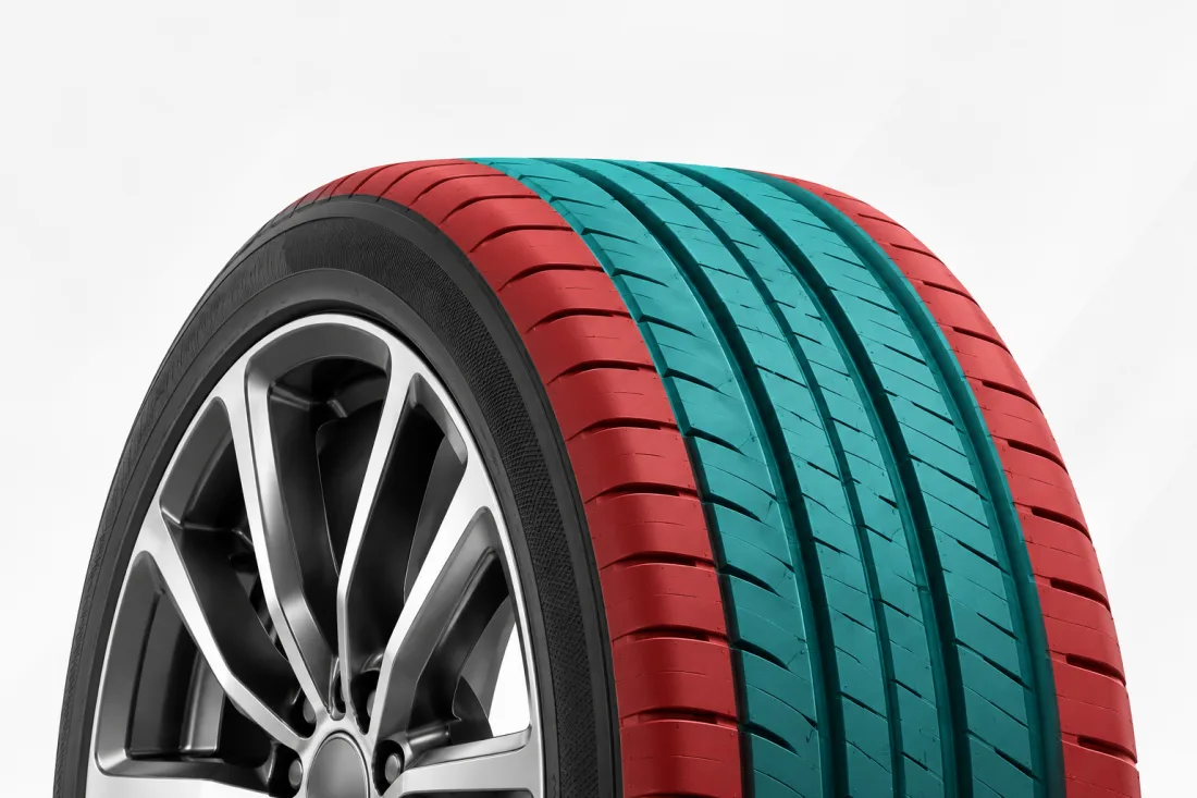 A tire with the centre of the tread shaded teal, where a puncture can be repaired, and the shoulders on either side shaded red, where it can't.